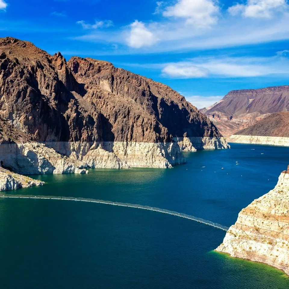 Lake Mead’s blue water between desert cliffs