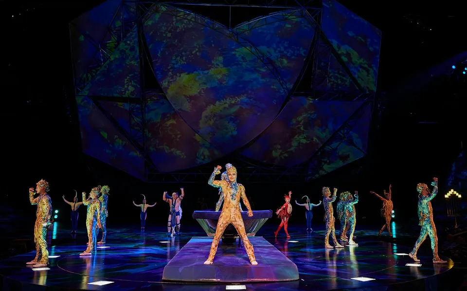 Mystère ensemble performing on a blue-lit stage