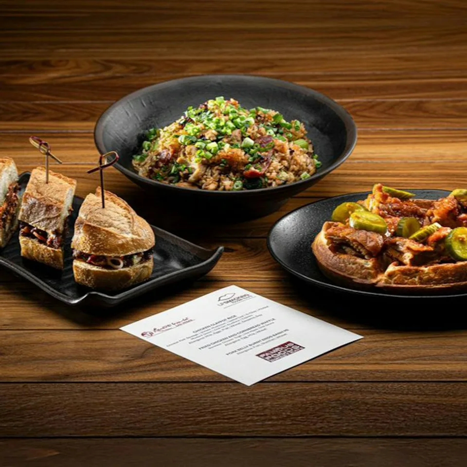 Food tasting dishes and a menu arranged on a table