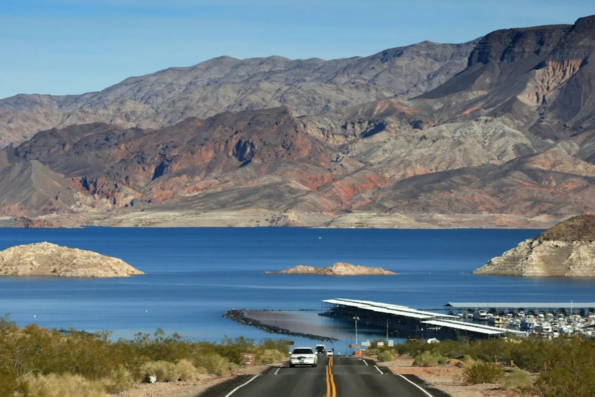 A road descending towards Lake Mead and a marina
